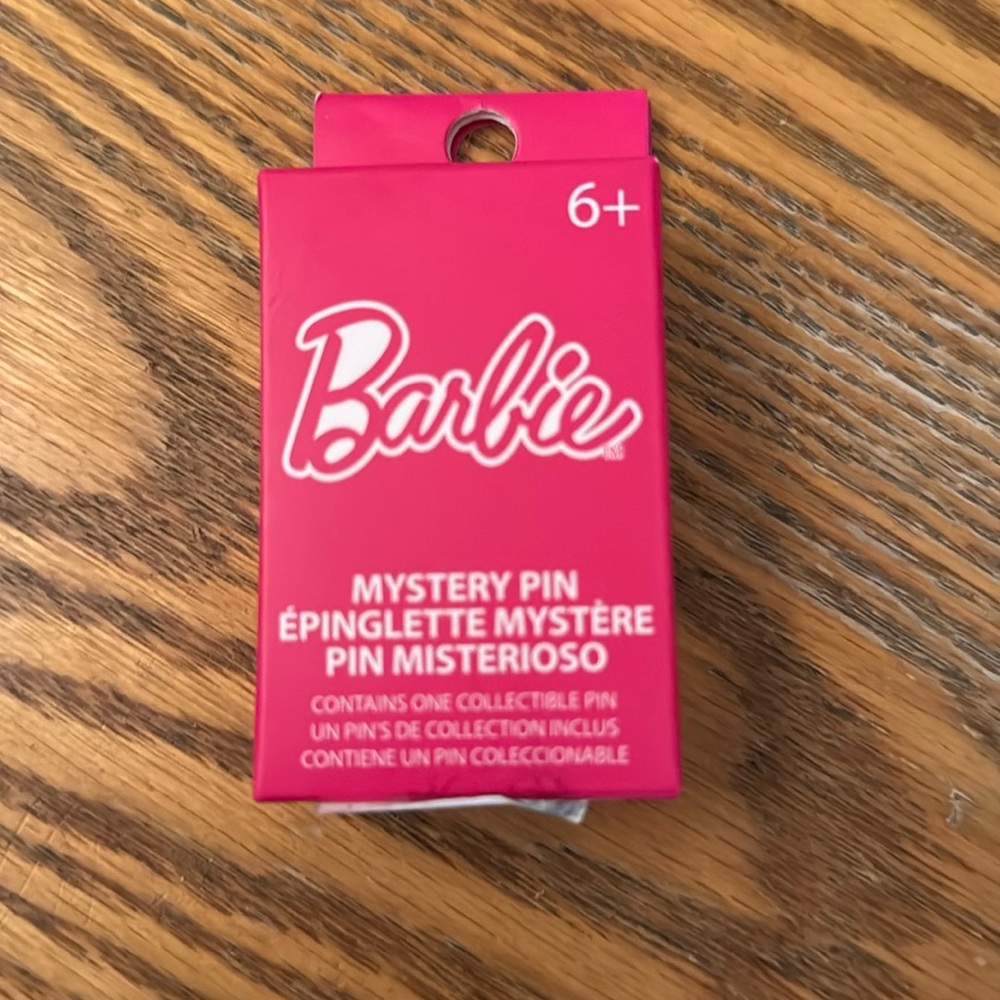 Barbie mystery pin